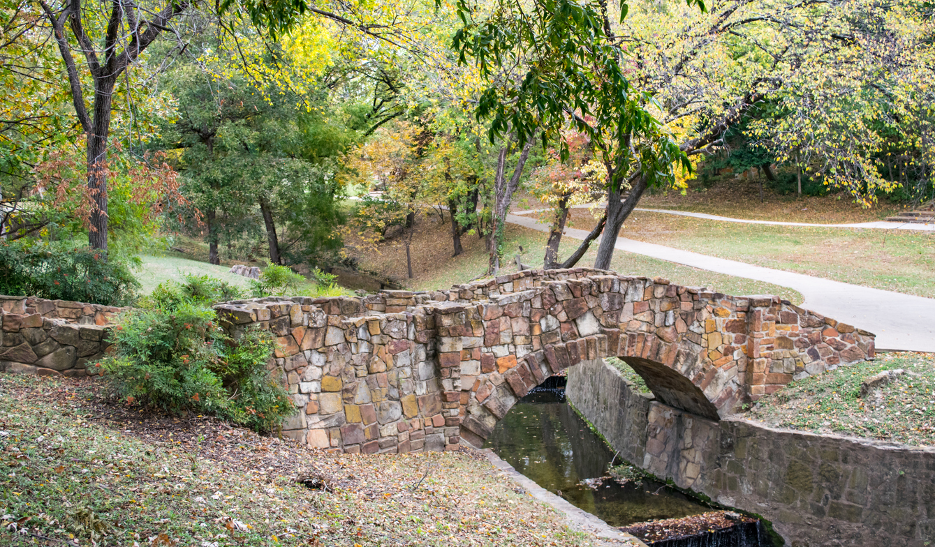 Picturesque stone pedestrian bridge in Dallas Park