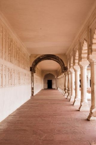 A hallway with concrete columns